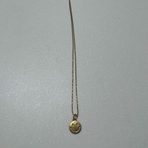 Gold smiley face necklace